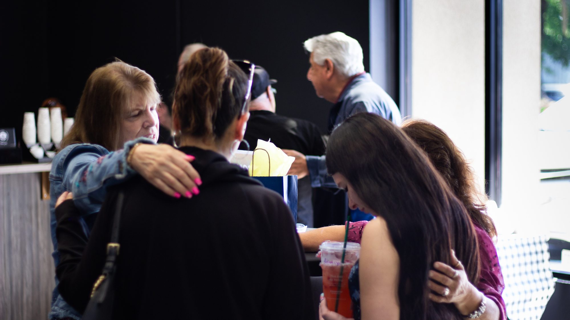 The LifeBridge lobby after a Sunday service, full of people greeting and hugging each other