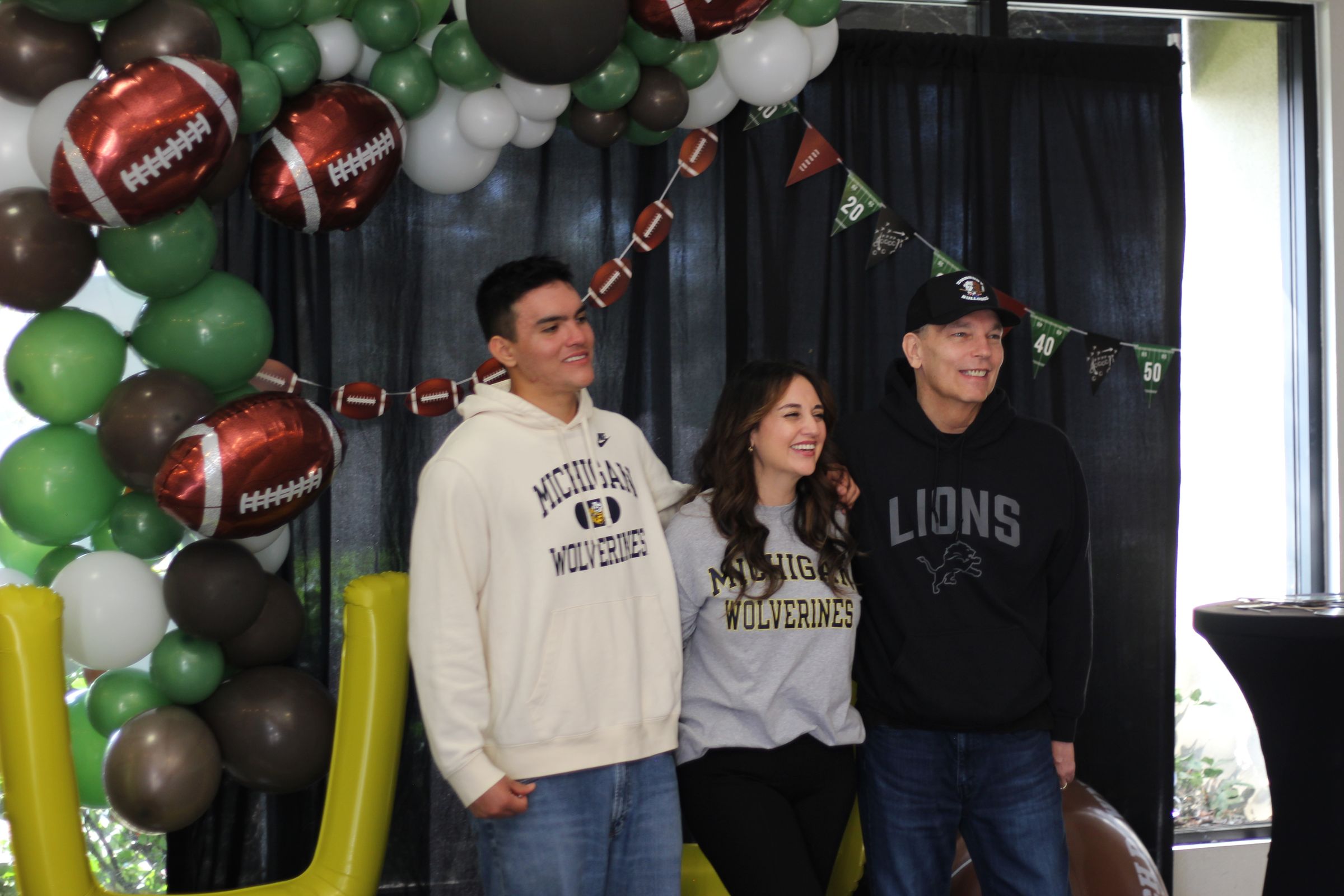 A couple at the LifeBridge Draft Sunday photo booth