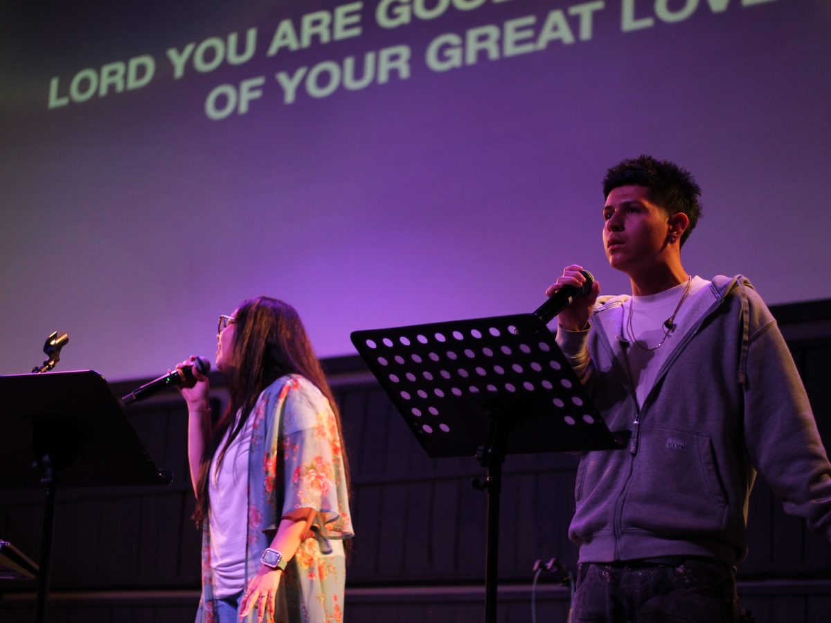 Two worship leaders singing on a Sunday morning
