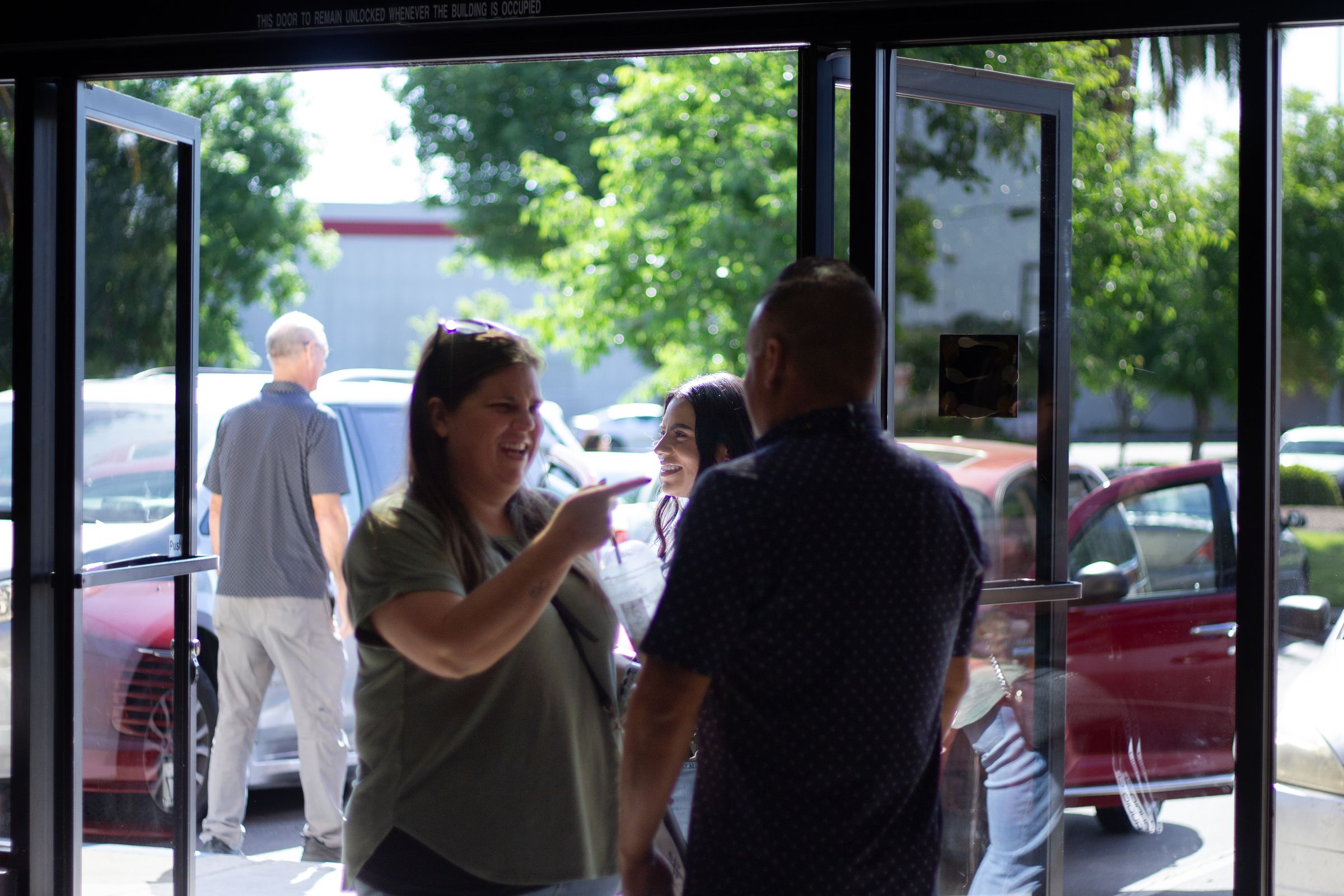 Greeters welcoming people at the LifeBridge entrance on a Sunday morning